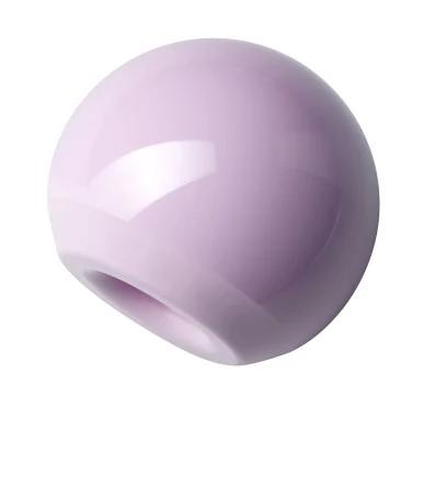 Ceramic femoral head with tapered bore, in the characteristic pink of high-performance surgical ceramic